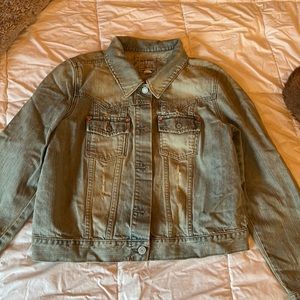 Distressed jean jacked with beading size xl